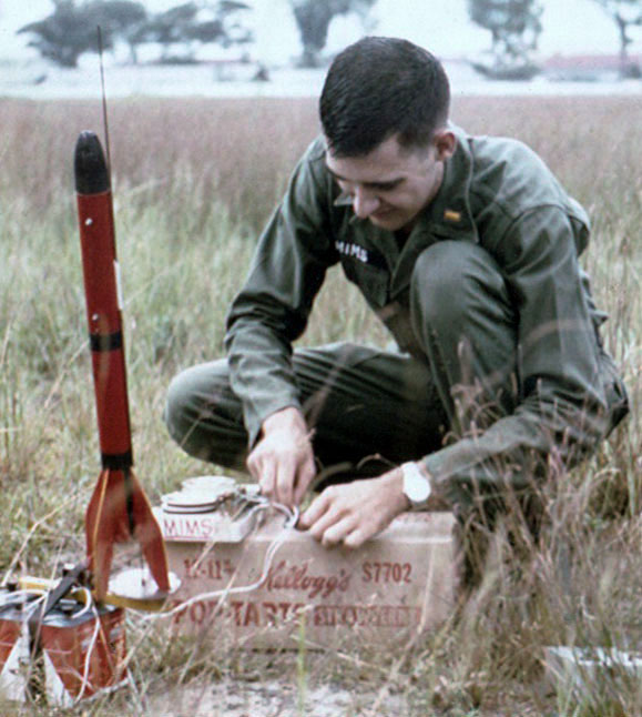 Forrest Mims preparing a model rocket for launch near Saigon, Vietnam, 1967
